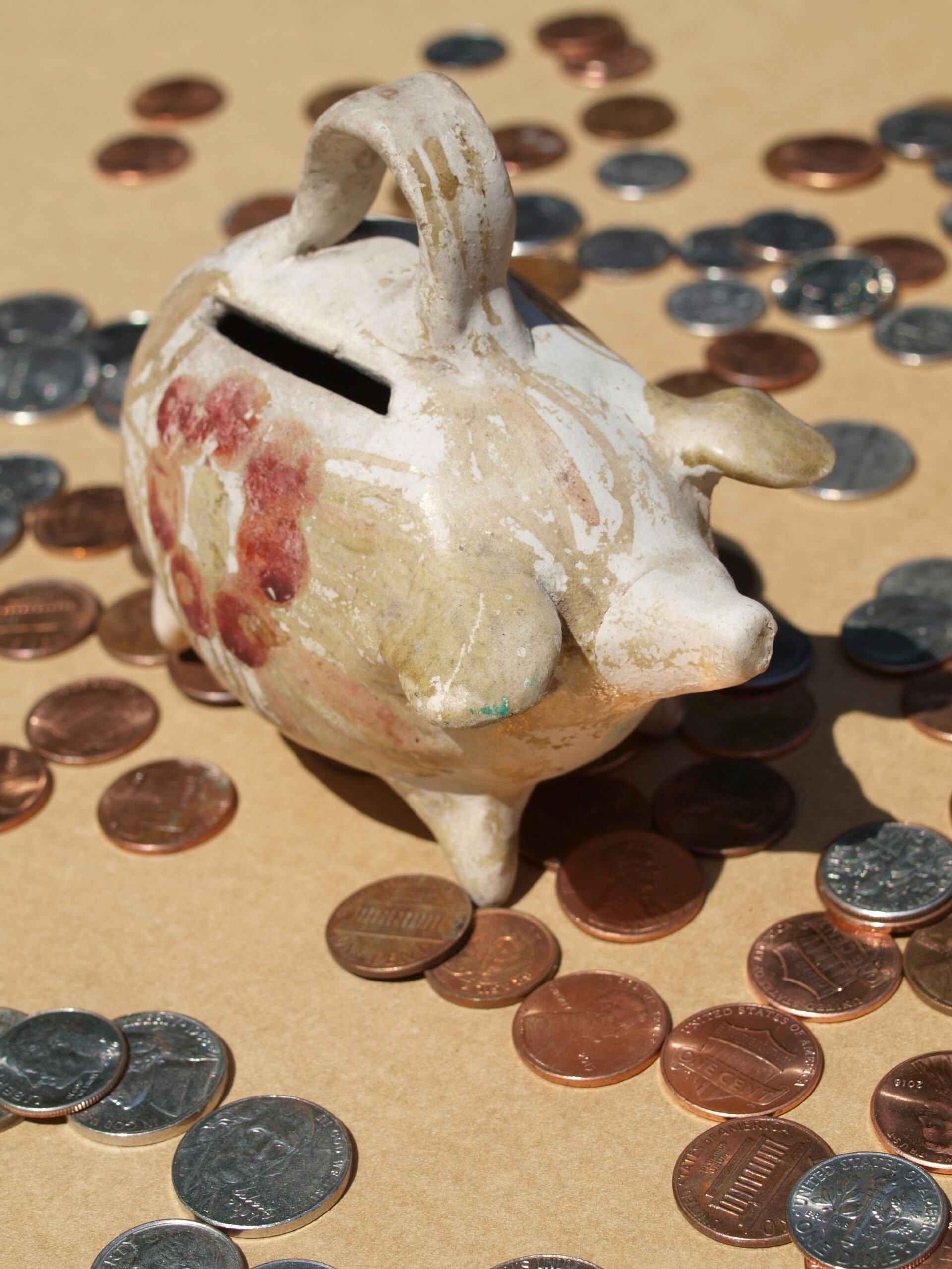 Coin bank on a table, symbolising saving and budgeting.